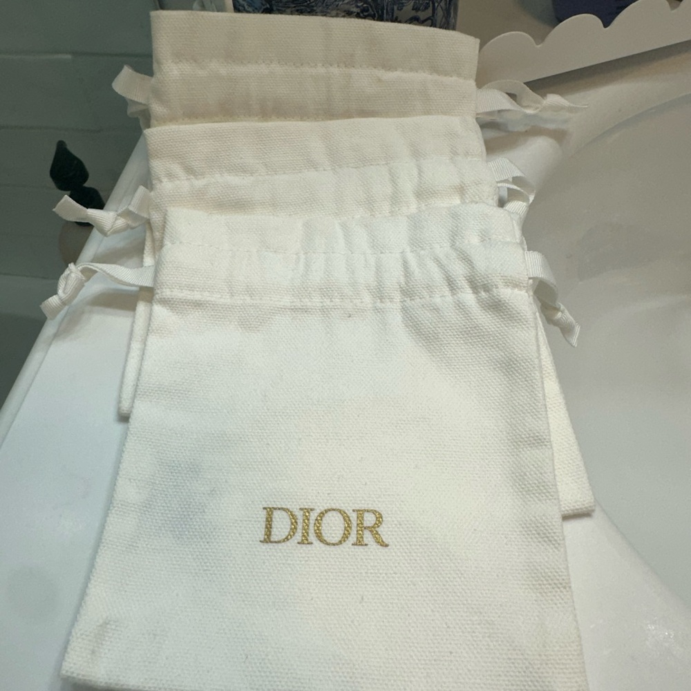 3 Dior Cream Drawstring Cosmetic Bag